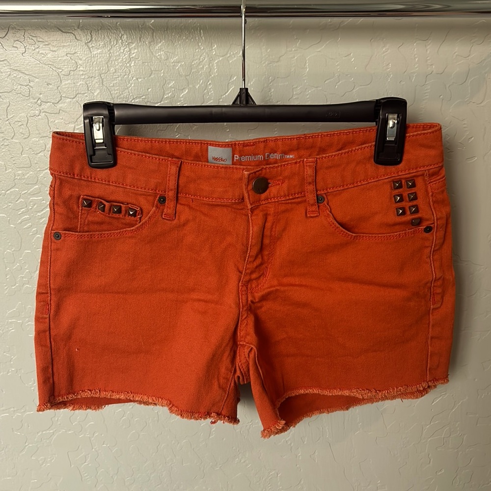 Studded orange raw hem shorts